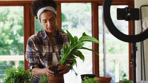 Woman Plants and Talks in Front of Ring Light