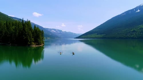 People kayaking in lake 4k