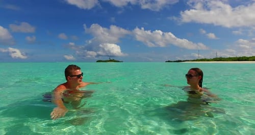 Romantic couple after marriage in love enjoy luxury on beach on white sand 4K background