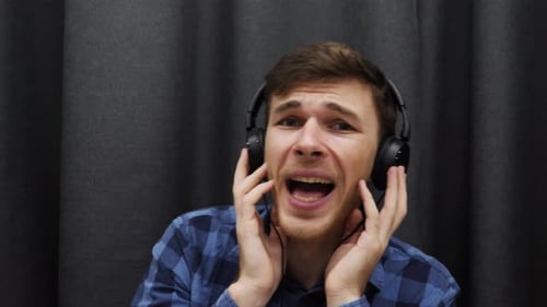 Man singing to the camera