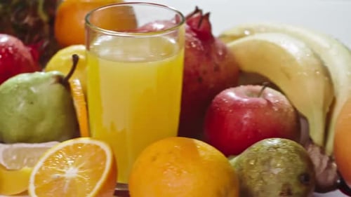 Fresh Fruits Assortment with a Glass of Juice