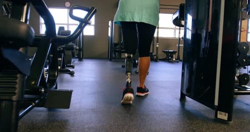 Senior woman walking in fitness studio 4k