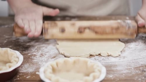 Rolling Dough on Wooden Surface
