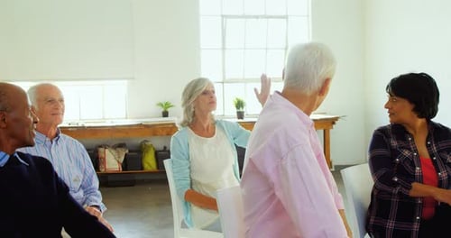 Engaged Seniors Participating in Group Conversation