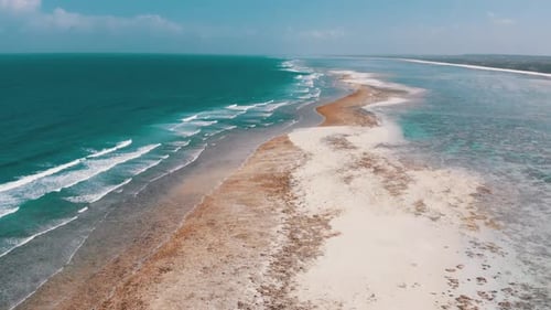 Ocean Coastline and Barrier Reef at Low Tide Zanzibar Matemwe Aerial View