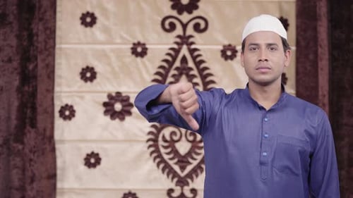 Man Giving Thumbs Down Gesture with Hand