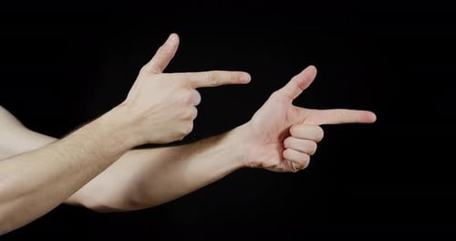 Hands Pointing Like Guns on Black Background