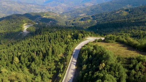 steep green mountains, deep forest and mountain road, beautiful valley