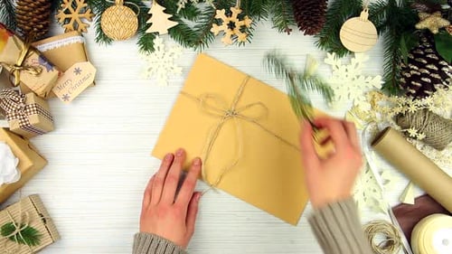 Decorating a Christmas Present at Home, Top Down