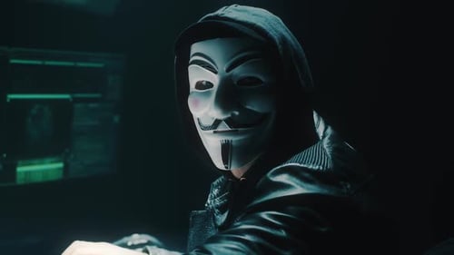 Male Cybercriminal Looking at the Camera