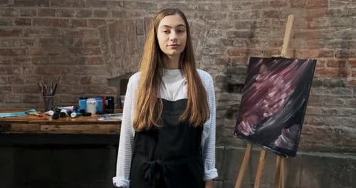 Female Artist Smiling in Her Creative Studio