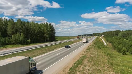 Timelapse of Highway traffic and clouds.