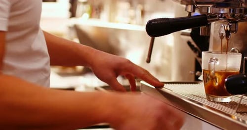 Barista Preparing Espresso Drink With Professional Machine