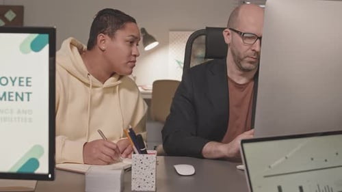 Diverse Colleagues Working Late in Office