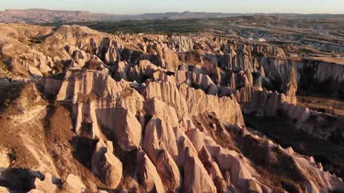 Aerial view of Red Valley and Rose Valley at sunset in Cappadocia, Turkey