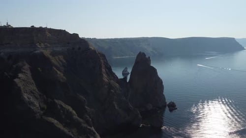 Aerial View From Above on Calm Azure Sea and Volcanic Rocky Shores