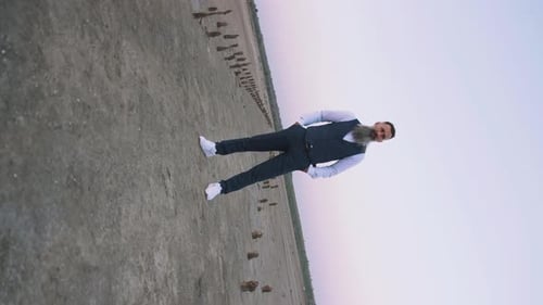 Stylish Bearded Man Posing in a Desert Landscape