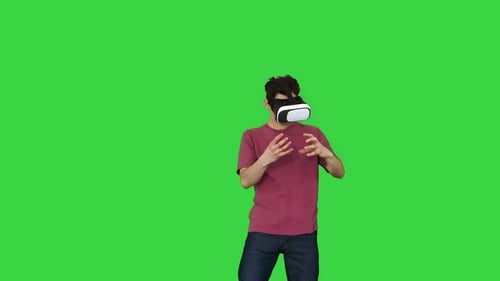 Man Wearing VR Headset Interacting on Green Screen