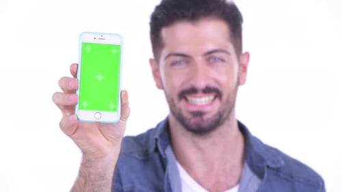 Man Holding Smartphone with Green Screen Close Up