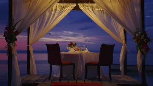 Romantic Dinner on Tropical Beach at Sunset