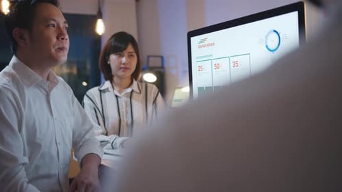 Group of Asia businessman and businesswoman using computer presentation and communication meeting.