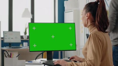 Adult Using Green Screen on Computer Display
