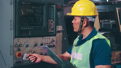 Smart Factory Worker Using Machine in Factory Workshop