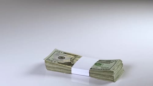 Stacks of Twenty Dollar Bills on White Surface