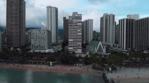 Aerial drone footage of Honolulu, Hawaii.
Beautiful real estate, buildings in the city.
Palm trees