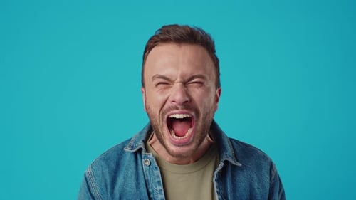 Man Shouting and Screaming in Distress on Blue