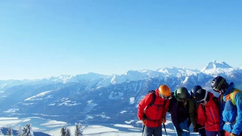Skiers with ski interacting on snowy landscape