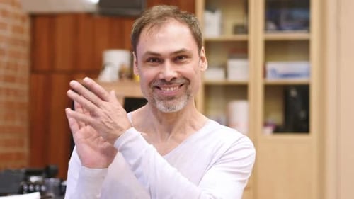 Man Smiling and Clapping Hands, Close Up