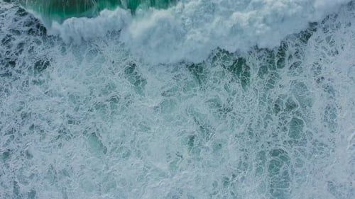White Foam on Rolling Waves of Ocean Water on Sunny Day