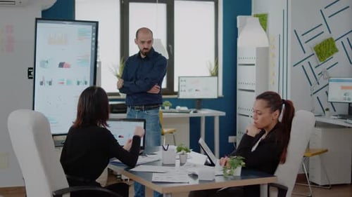 Team Discussing Data During Corporate Presentation