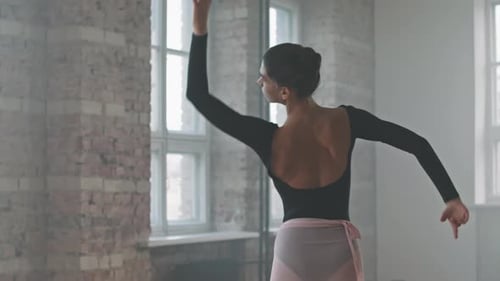 Sensual Ballerina Dancing Alone In Ballet Studio