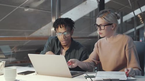 Colleagues Collaborating on a Project in the Office