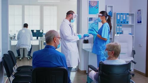 Inside Hospital Waiting Room with Staff and Patients