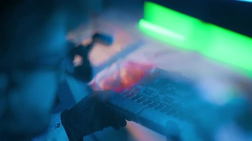 Scientist Inspecting Computer Chip in High Tech Lab