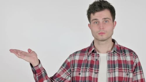 Portrait of Young Man Holding Product in Hand
