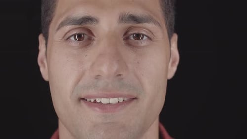 Young Adult Opens Eyes and Smiles Close Up