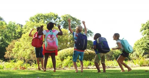Group of kids jumping together in park