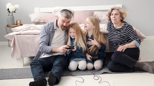 Happy Family Playing Video Games at Home