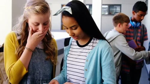 Teens Socializing and Learning in School Hallway