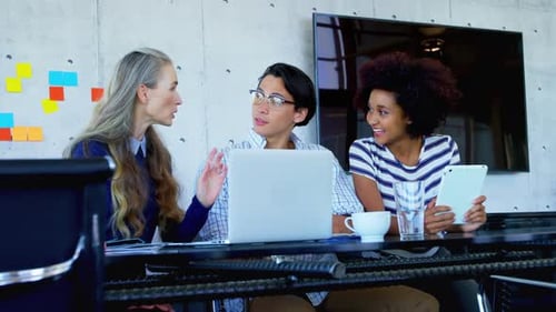 Diverse Team Brainstorming Ideas in a Modern Office