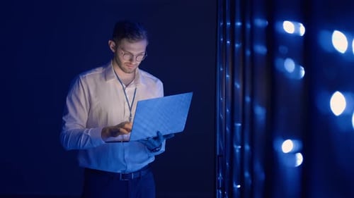 Data Center IT Specialists Coworking in Secure Server Room of Cyberspace