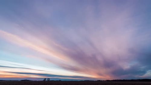 Colorful sunset clouds in the field time lapse