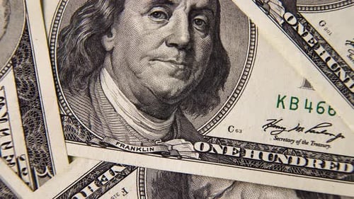 Background with One Hundred Dollar Bills on a Rotating Platform.