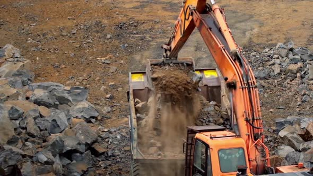 Working mining machines. Quarry mining with heavy industrial machinery ...