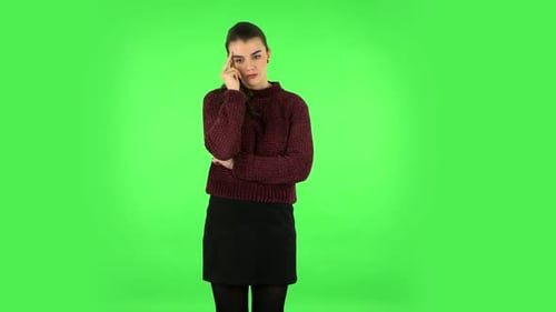 Young Girl Thinks About Something. Green Screen