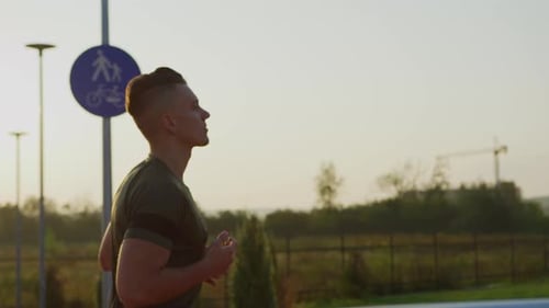 Young Man Jogging During Golden Hour